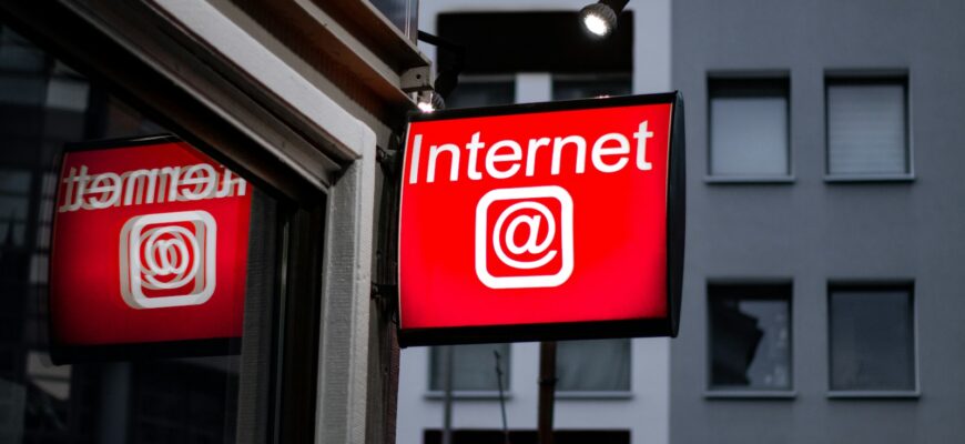 Internet LED signage beside building near buildings