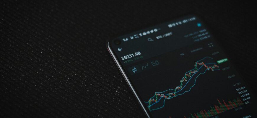 black android smartphone on black textile