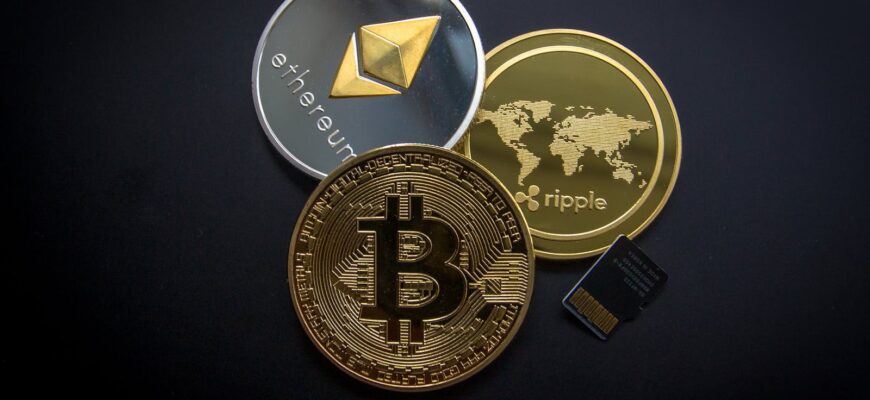 A striking image of Bitcoin, Ethereum, and Ripple coins illustrating modern digital currency.