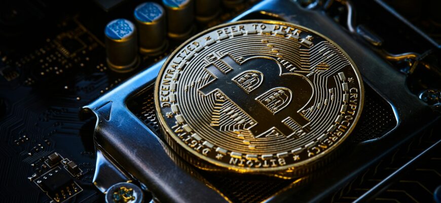 a bitcoin on top of a computer motherboard