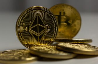 a pile of gold bitcoins sitting on top of a table