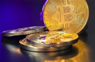 a pile of gold bitcoins sitting on top of a table