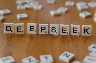 A wooden table topped with scrabble tiles spelling the word depeseek